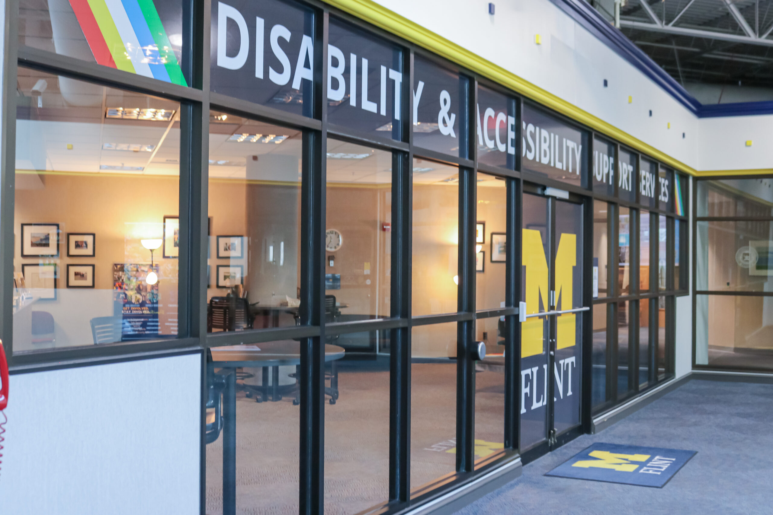Entrance to the Disability and Accessibility Support Services office, featuring large signage and a logo for the University of Michigan-Flint.
