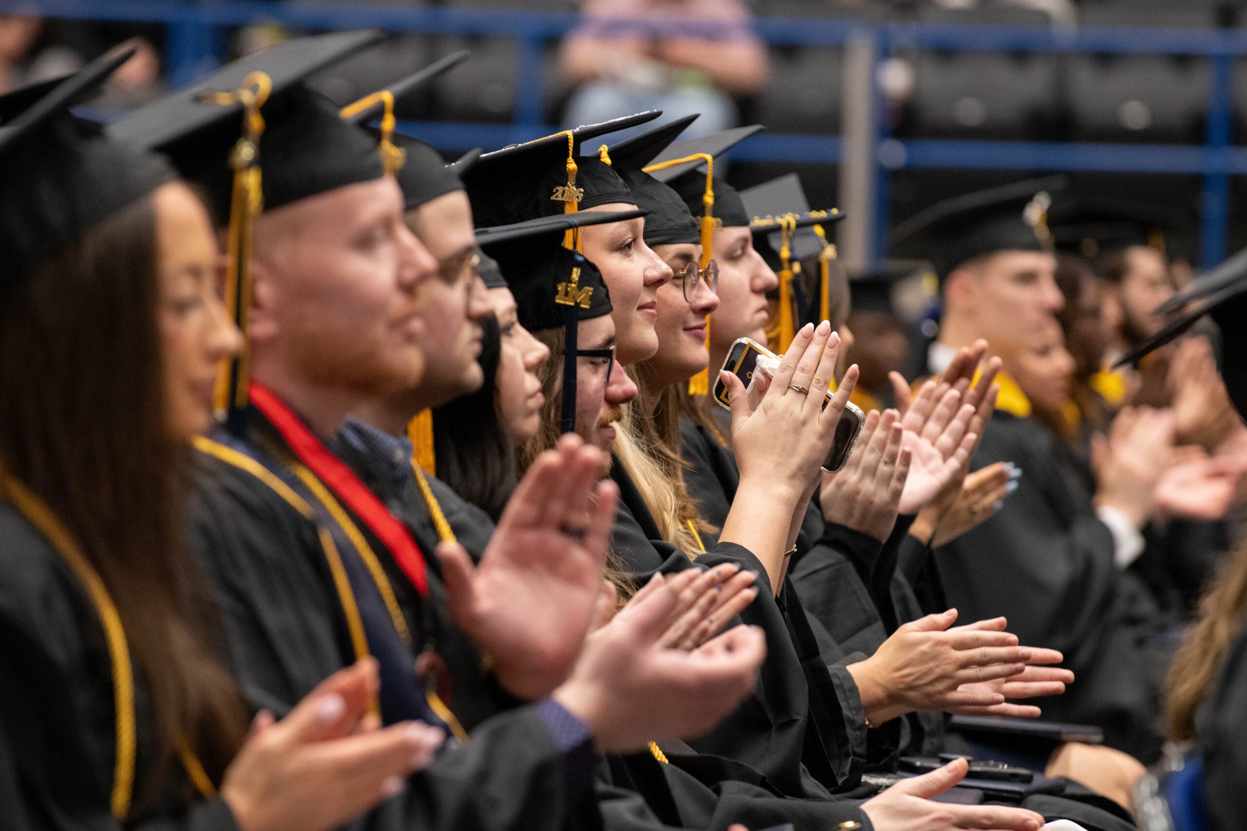 Students celebrate during the University of Michigan-Flint Winter Commencement ceremony at the Dort Financial Center in Flint, Michigan, on May 3, 2026.