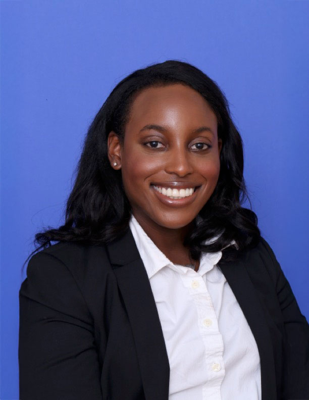 Jade L smiling in a professional outfit against a blue background.