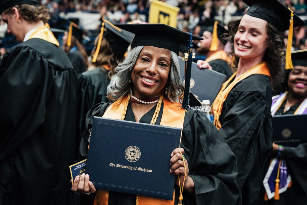Students celebrate during the University of Michigan-Flint Winter Commencement ceremony at the Dort Financial Center in Flint, Michigan, on May 3, 2026.