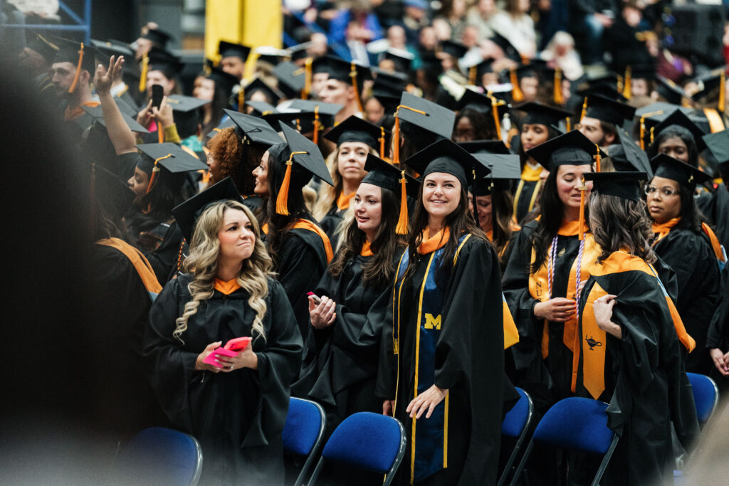 Students celebrate during the University of Michigan-Flint Winter Commencement ceremony at the Dort Financial Center in Flint, Michigan, on May 3, 2026.
