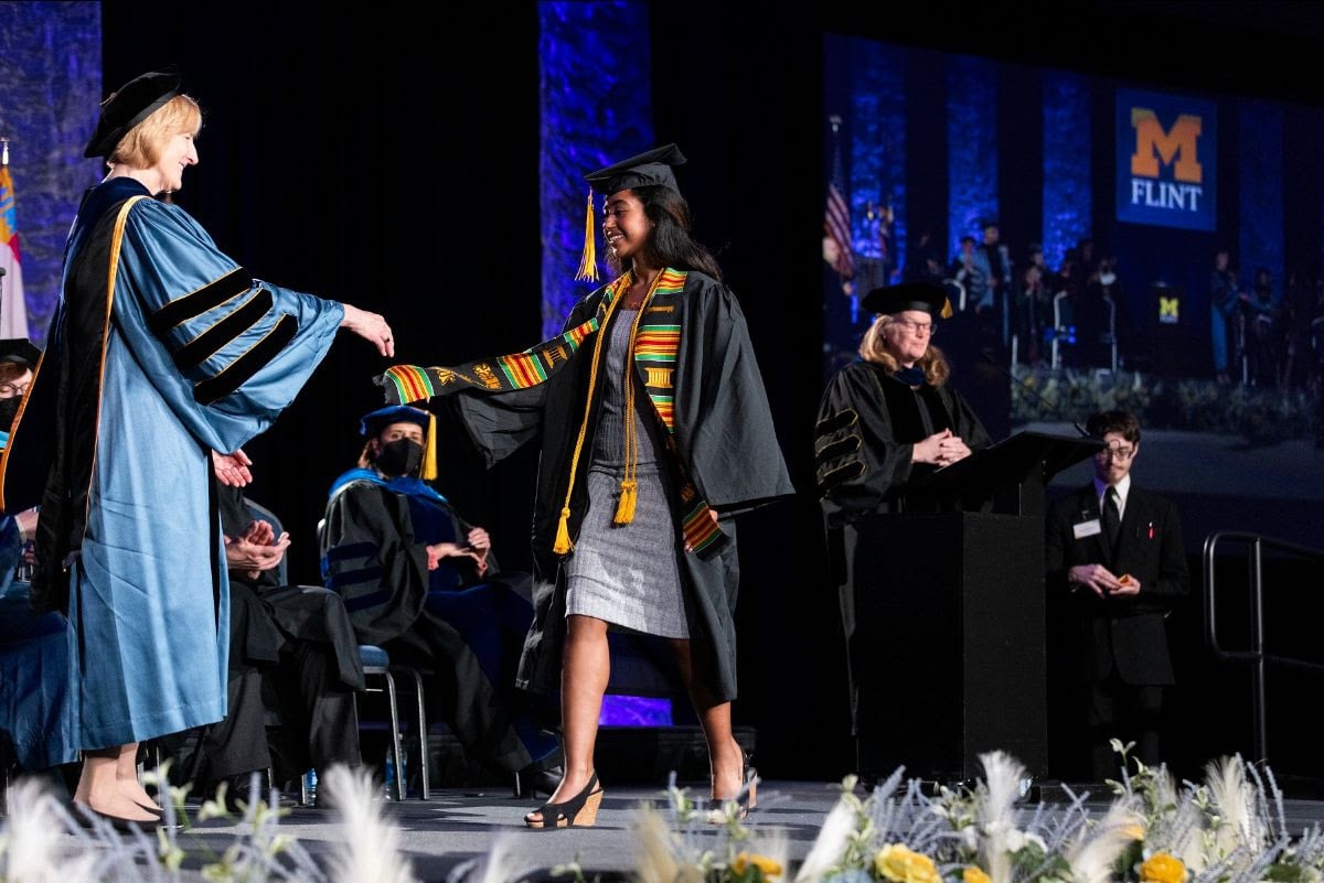 Young Woman receiving a diploma