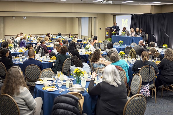 a large room of people at a conference