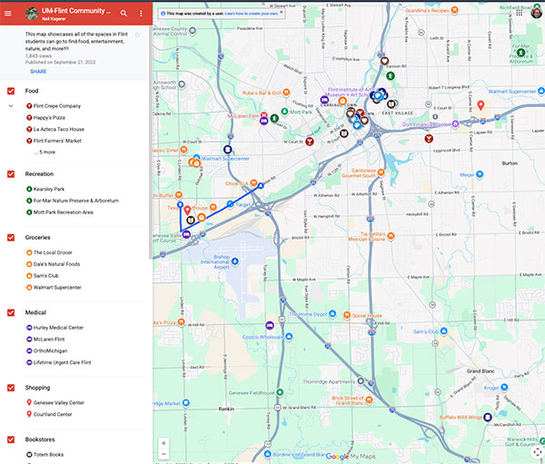 Map showing various locations with icons representing different categories, including businesses and amenities, in a city area.
