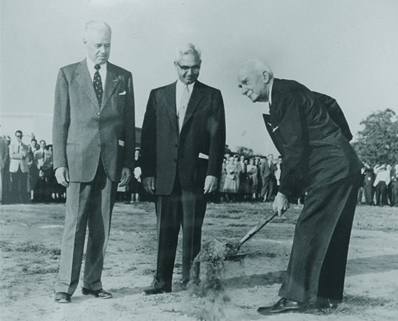 Governor G. Mennen Williams, Harlan Hatcher and C.S. Mott breaking ground with shovels.